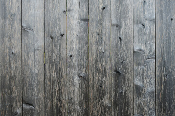 An abstract image of weathered grey barn board wood texture.