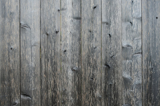 An abstract image of weathered grey barn board wood texture.