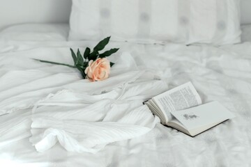 bed with flowers and book