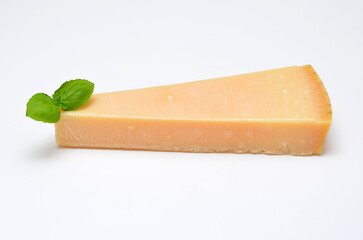 hard parmesan type cheese on a white background close-up
