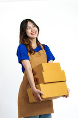 Young pretty asian woman with apron holding packages box of product for delivery sme entrepreneur owner isolated on white background.