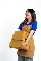 Young pretty asian woman with apron holding packages box of product for delivery sme entrepreneur owner isolated on white background.