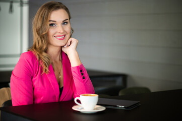 Beautiful woman having a coffee in a cafe