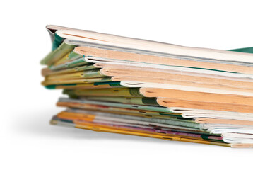 Pile of magazines on white background