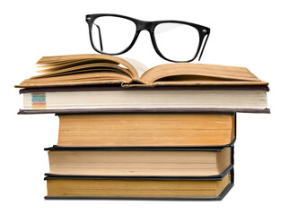 A pile of old books and a pair of eyeglasses