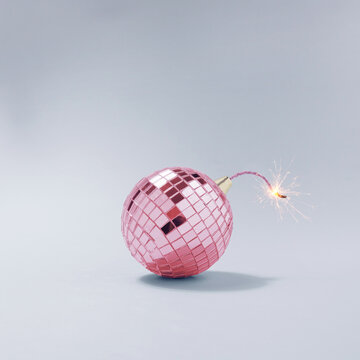 Pink disco ball fuse bomb concept. Time for party.