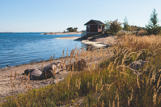 View of Hanko town coast, Hango, Finland, with beach and coastal waterfront, wooden houses and beach changing cabins, Uusimaa, Hanko Peninsula, Raseborg sub-region, summer sunny day