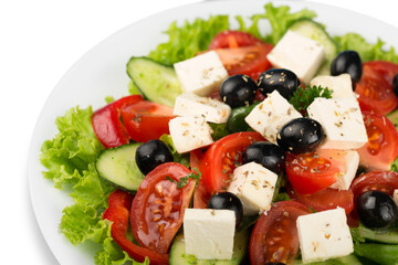 Greek salad with fresh vegetables on background