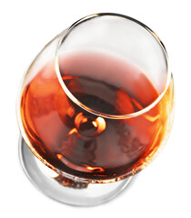 Splash of cognac in glass on white background
