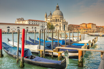 Fototapeta na wymiar Gondolas in Grand Canal and Santa Maria Della Salute, Venice, Italy