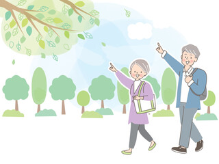 人差し指を立てて案内するシニア夫婦のベクターイラスト素材