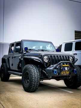 Front view of the Black 2018 Jeep Wrangler JLU car, close-up, vertical
