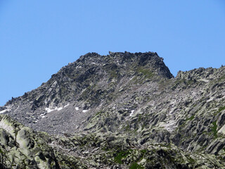 Rocky mountain peak Pizzo della Valletta (2726 m) in the massif of the Swiss Alps above the St. Gotthard Pass (Gotthardpass), Airolo - Canton of Ticino (Tessin), Switzerland (Schweiz)