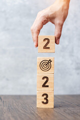 2023 block with dartboard sign. Business Goal, Target, Resolution, strategy, plan, Action...