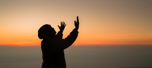 Concept Christian person worship or pray to God. Christian man silhouette with love, faith,...
