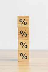 wood  block with percentage symbol icon. Interest rate, financial, inflation, recession, ranking and mortgage rates concept - obrazy, fototapety, plakaty