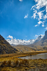 Road to the lagoon with vertical view of the snow-capped mountains