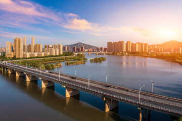 Aerial view of city skyline and modern buildings in bengbu at sunset, China.