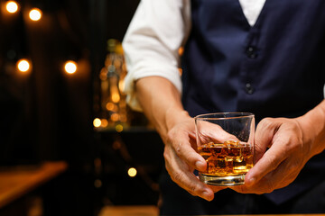 Bartender pouring Whiskey, on  bar,