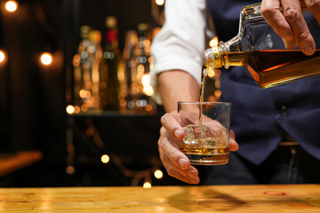 businessmen holding a glass of whiskey