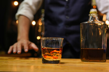 Bartender pouring Whiskey, on  bar,