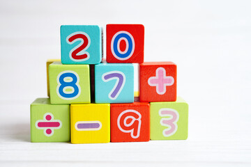 Number wood block cubes for learning Mathematic, education math concept.