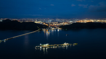 oil tanker ship loading in port, Oil tanker ship under cargo operations on typical shore station...