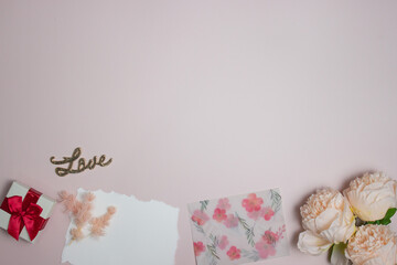 Letter with envelop with flowers with Love letter over the pink background with copy space.