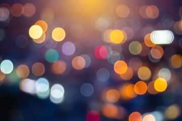 Abstract city lights blur blinking background. Soft focus horizontal long banner. Bokeh sparkles colorful defocused on dark texture for night party city. Abstract blurred pattern template.