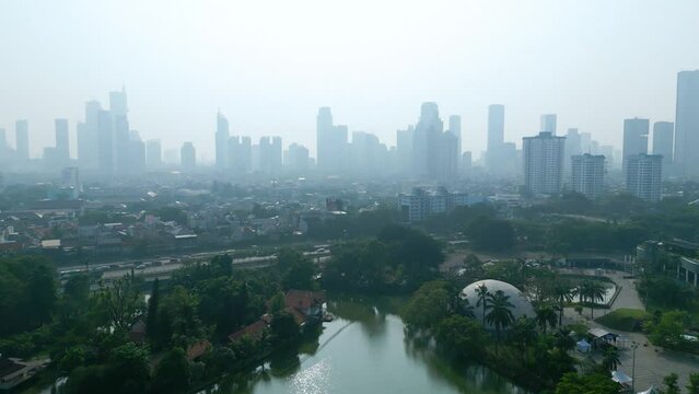 Air pollution covering Jakarta cityscape at morning