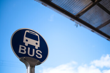 Fototapeta premium Bus stop under the blue sky.