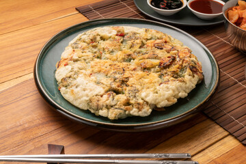 Korean pancake or Pajeon, Korean  dish made from egg and wheat flour with chili and chives vegetable.