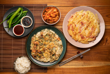 Korean pancake or Pajeon, Korean  dish made from egg and wheat flour with Potato bacon chili and chives.