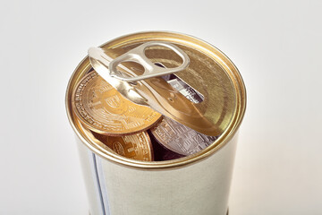 Bitcoin in a tin can. A coin in a tin can on a white background.