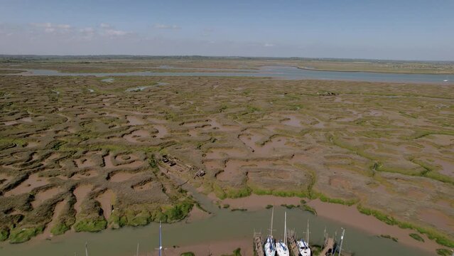 Boats In The Woodrolfe Creek Near The Tollesbury Fleet On A Sunny Day In Maldon, Essex, UK. - aerial