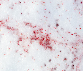 Drops of blood on white snow
