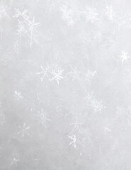 White snowflakes in winter as a background.