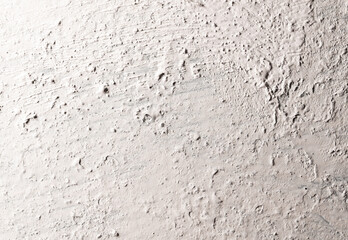 The metal wall is painted with white paint as an abstract background.