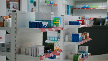 Empty pharmacy store filled with boxes of medicaments and supplements to help clients with disease. Drugstore shelves with packages of medication and drugs, bottles of pills and healthcare products.