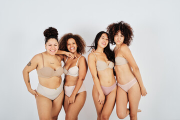 Happy diverse women with natural bodies in underwear