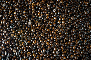 Coffee beans background wallpaper take from the top. Roasted coffee beans