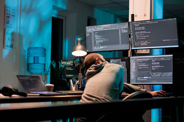 Database admin typing programming code on computer with multiple monitors, working with html script. Developing algorithms for artificial intelligence on terminal window, cloud computing.
