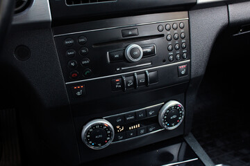Car dashboard, Multimedia, Air conditioner with power regulator. Car climate control. Automotive climate control. Modern Car air conditioner, interior of a new modern car.
