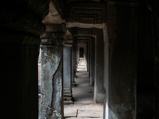 Corridor in the ruins of historical Angkor Wat in the woods, Cambodia