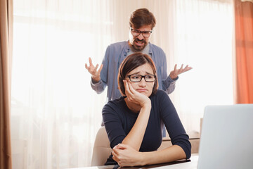 Portrait of attractive mad furious coworkers having fight crisis, scolding finance fail failure at living-room. couple shouting, having fight or dispute, Negative emotions, problems in relationships