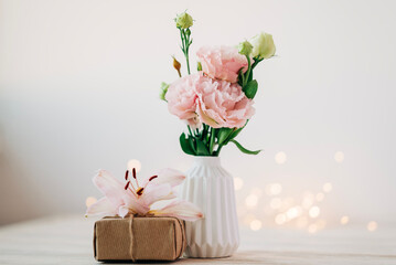 Pink bouquet of flowers with present box beautiful festive composition