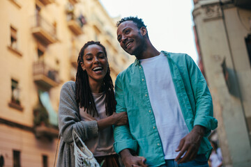 Smiling couple in city.