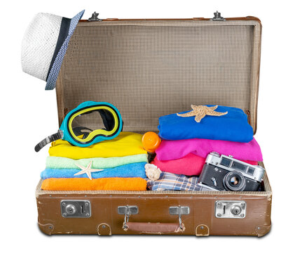 Tourist bag with clothes and summer vacation symbols
