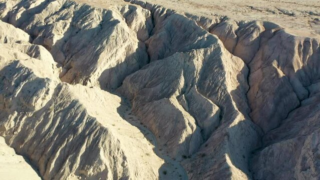 Aerial Flying Over Hills in Desert on Hot Dry Day - Arroyo Tapiado Mud Caves in Anza Borrego State Park