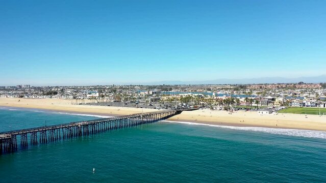 Slider Shot Aerial view of the Pier and Harborside Community on Balboa Peninsula Beach